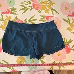 Ladies Nike, athletic shorts, size 12 with built-in liner, blue, and teal